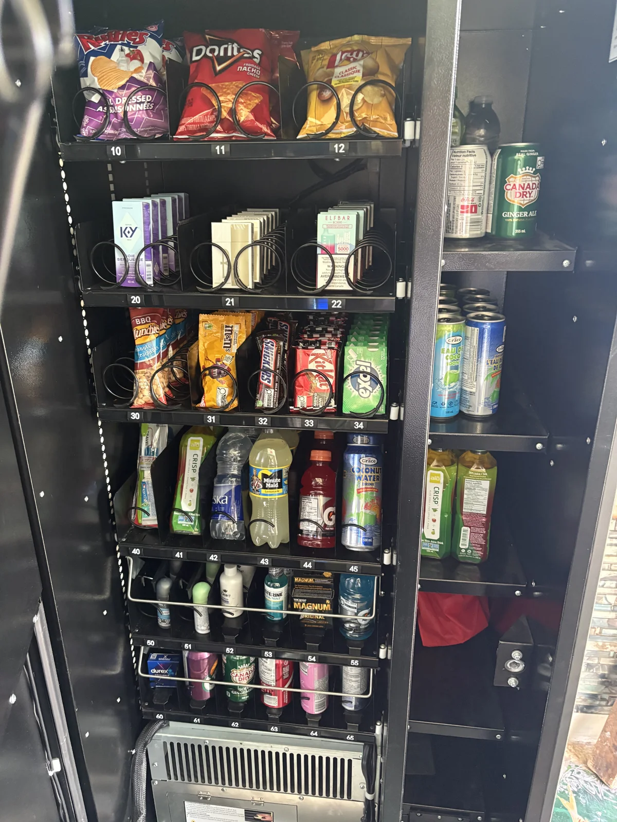 A full Elite vending machine showing a mixed selection of products