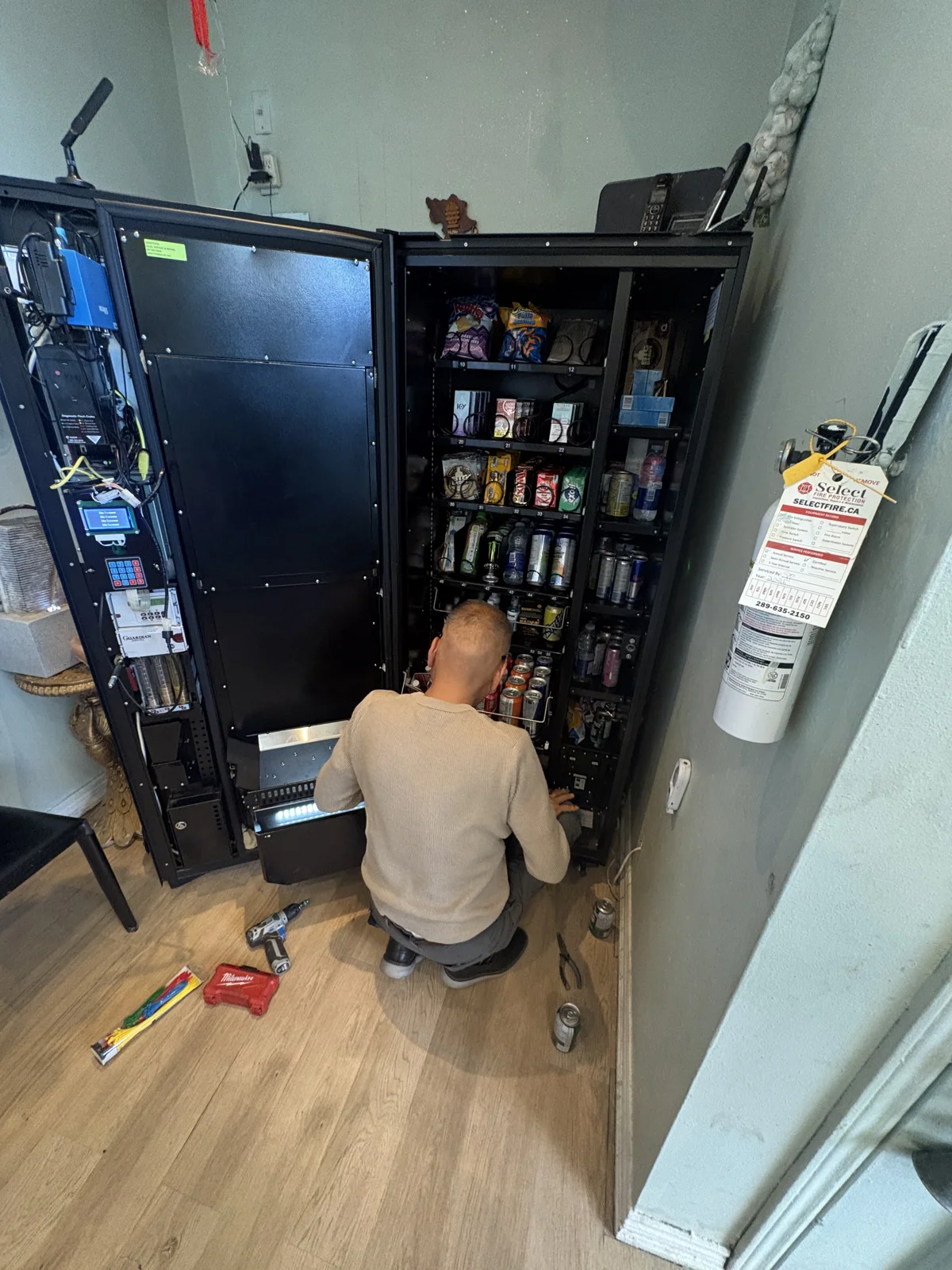 Hands-on servicing of an open vending machine