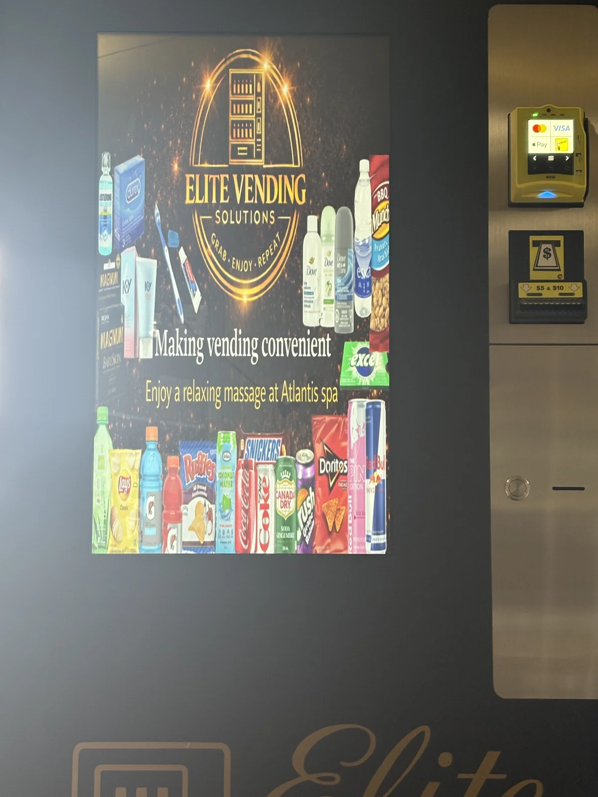 Elite-branded touchscreen vending machine with a colourful product display